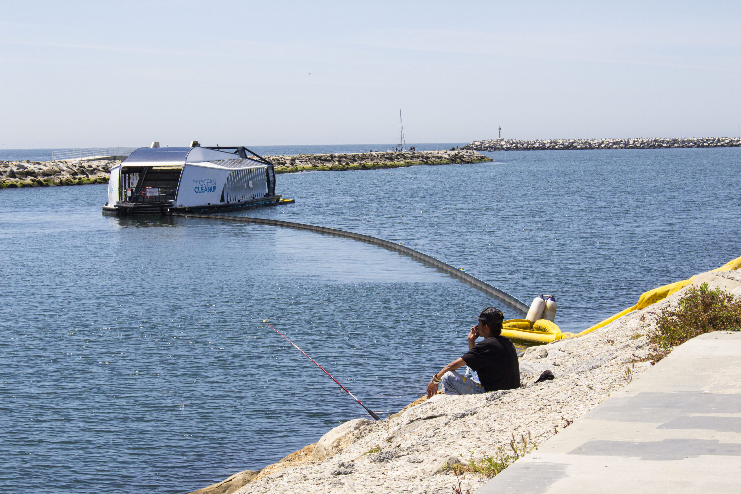 A giant computerized floating trashcan near campus is saving the ocean